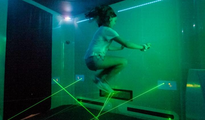 Girl dodging lasers