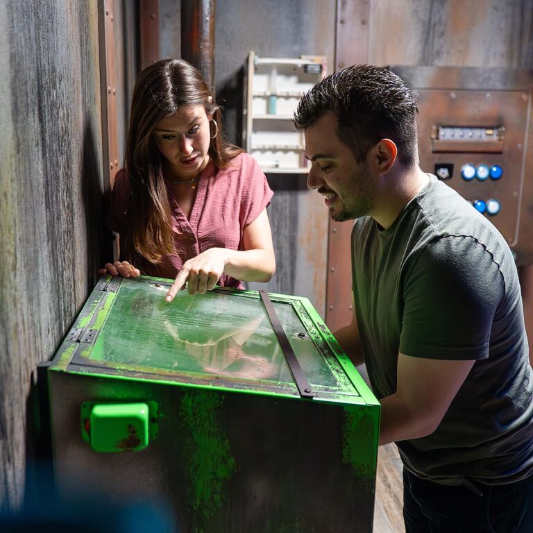 guests solving clue at escape room