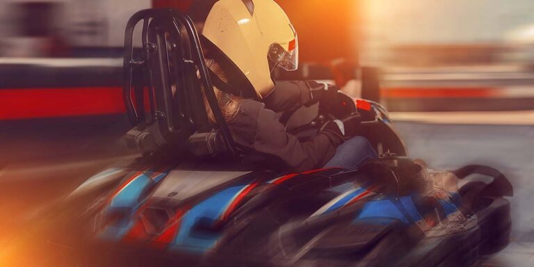 Indoor go-kart racing track at K1 Speed San Antonio, featuring sleek karts